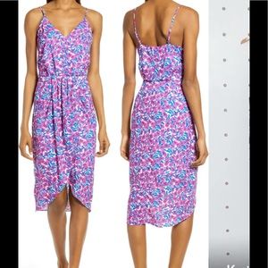Sleeveless faux wrap dress.